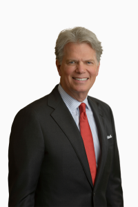 professional photo of certified financial planner Stewart Welch wearing black suit and red tie